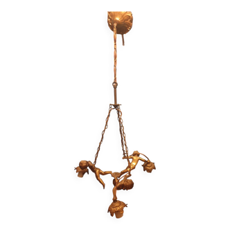 Antique chandelier decorated with cherubs and putti angels taken from the attic