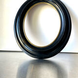 Black wooden oval frame