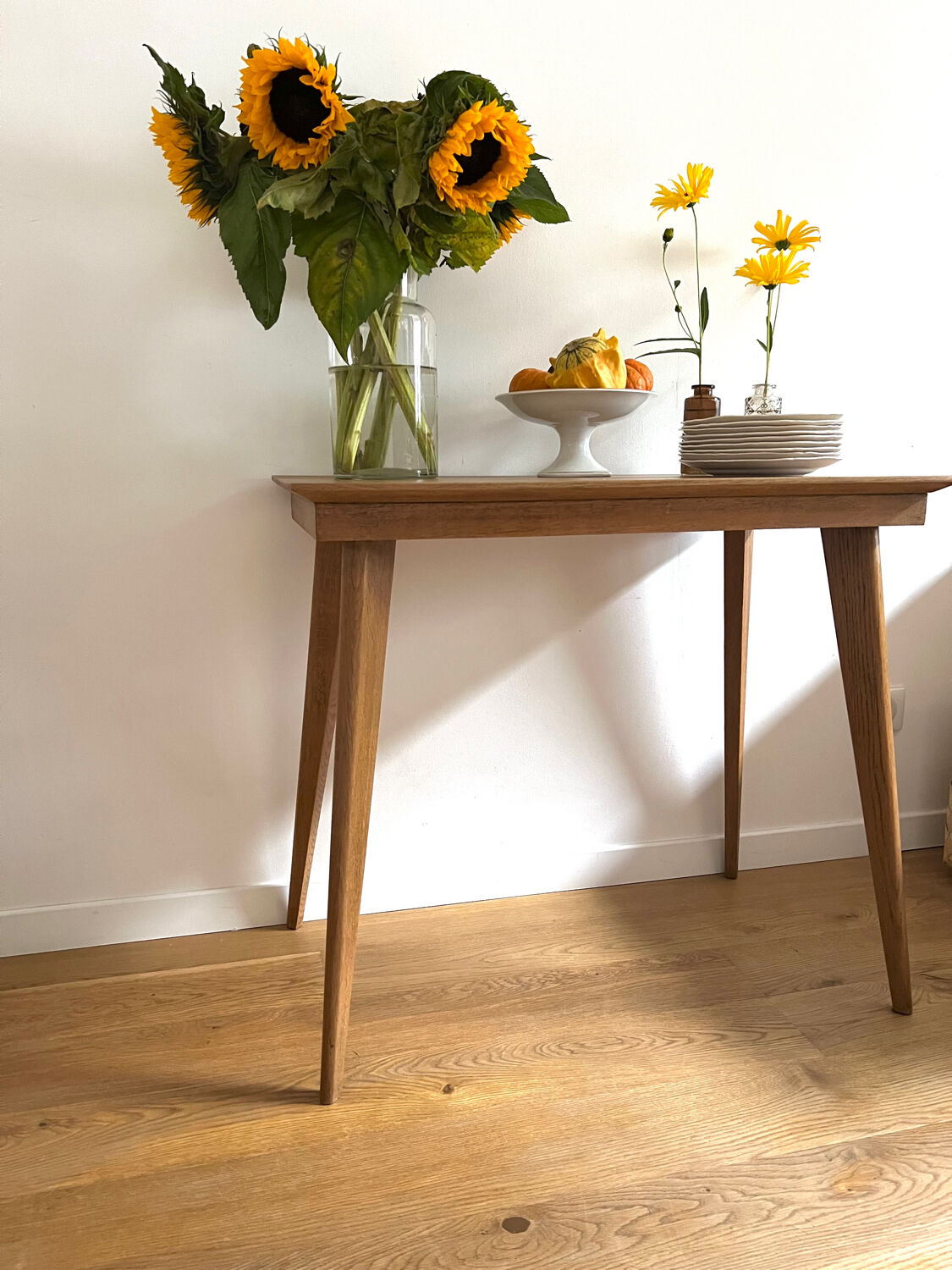 Side table with compass legs