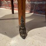 Wooden bedside table topped with a pink marble top