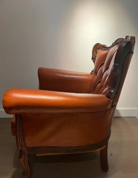 Chesterfield-style leather armchair