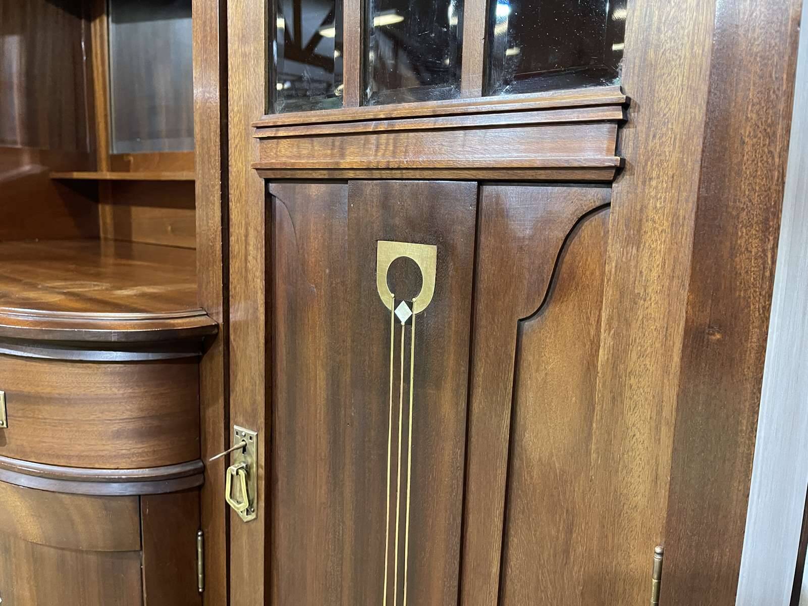Art Nouveau mahogany buffet with clock in the style of G. Serrurier Bovy.