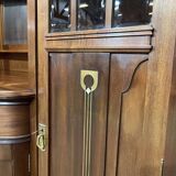 Art Nouveau mahogany buffet with clock in the style of G. Serrurier Bovy.