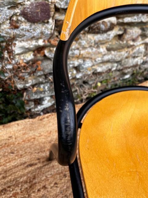 Pair of wooden and black metal chairs