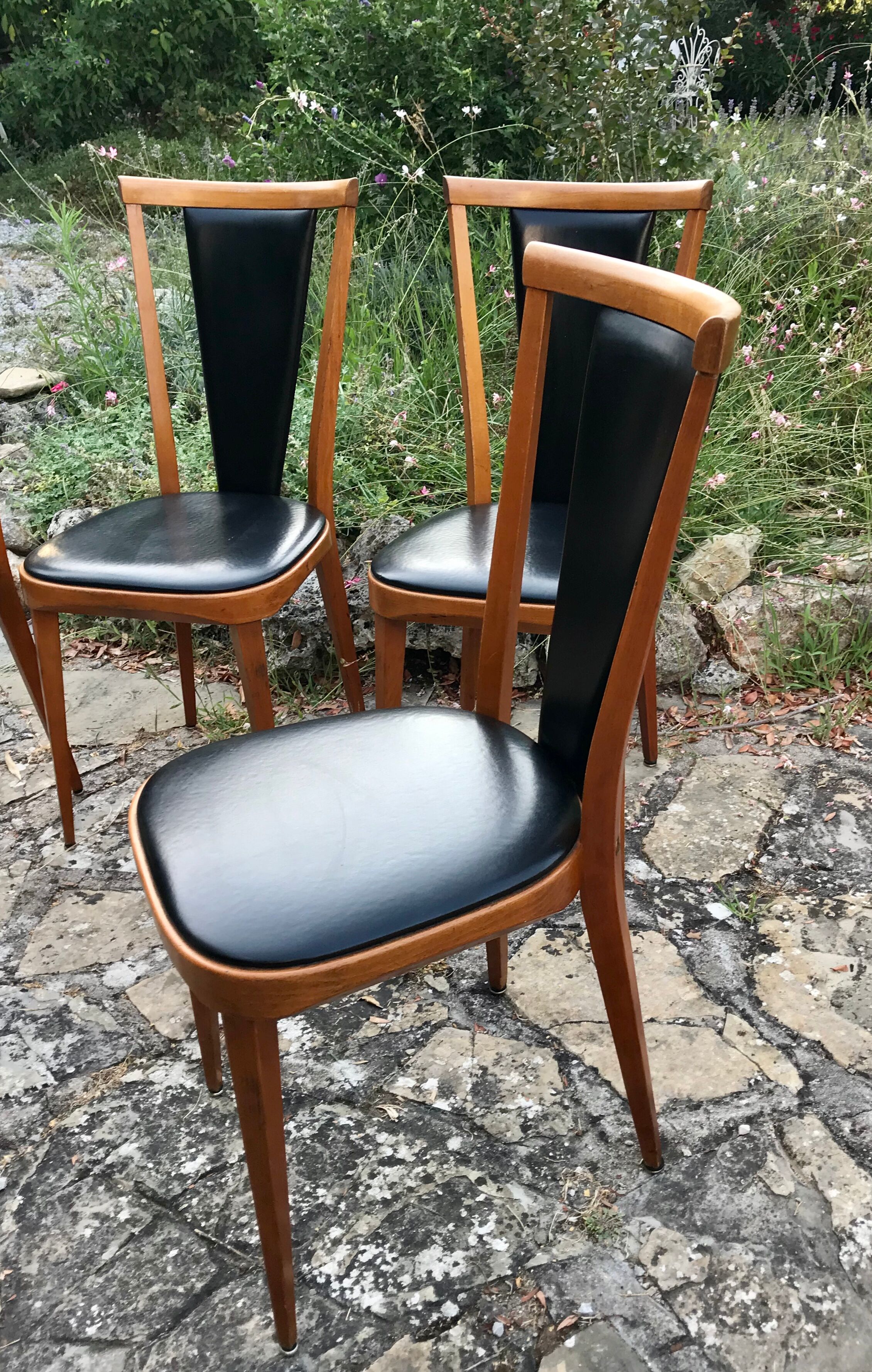 Four vintage beech and skai chairs