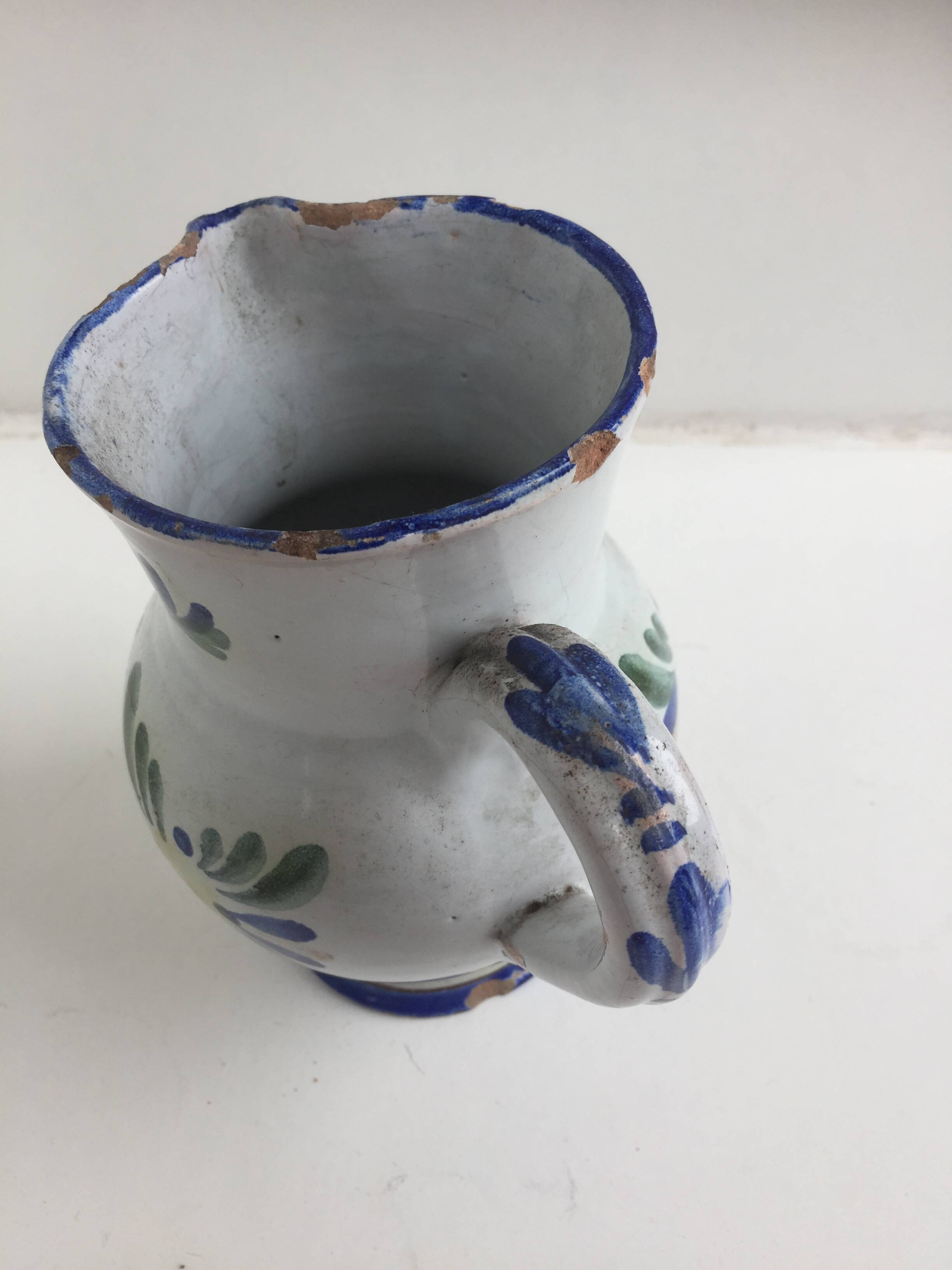 Old earthenware pitcher Beware at the Arthur biture