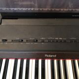 Roland HP 700 keyboard and its stand with pedal