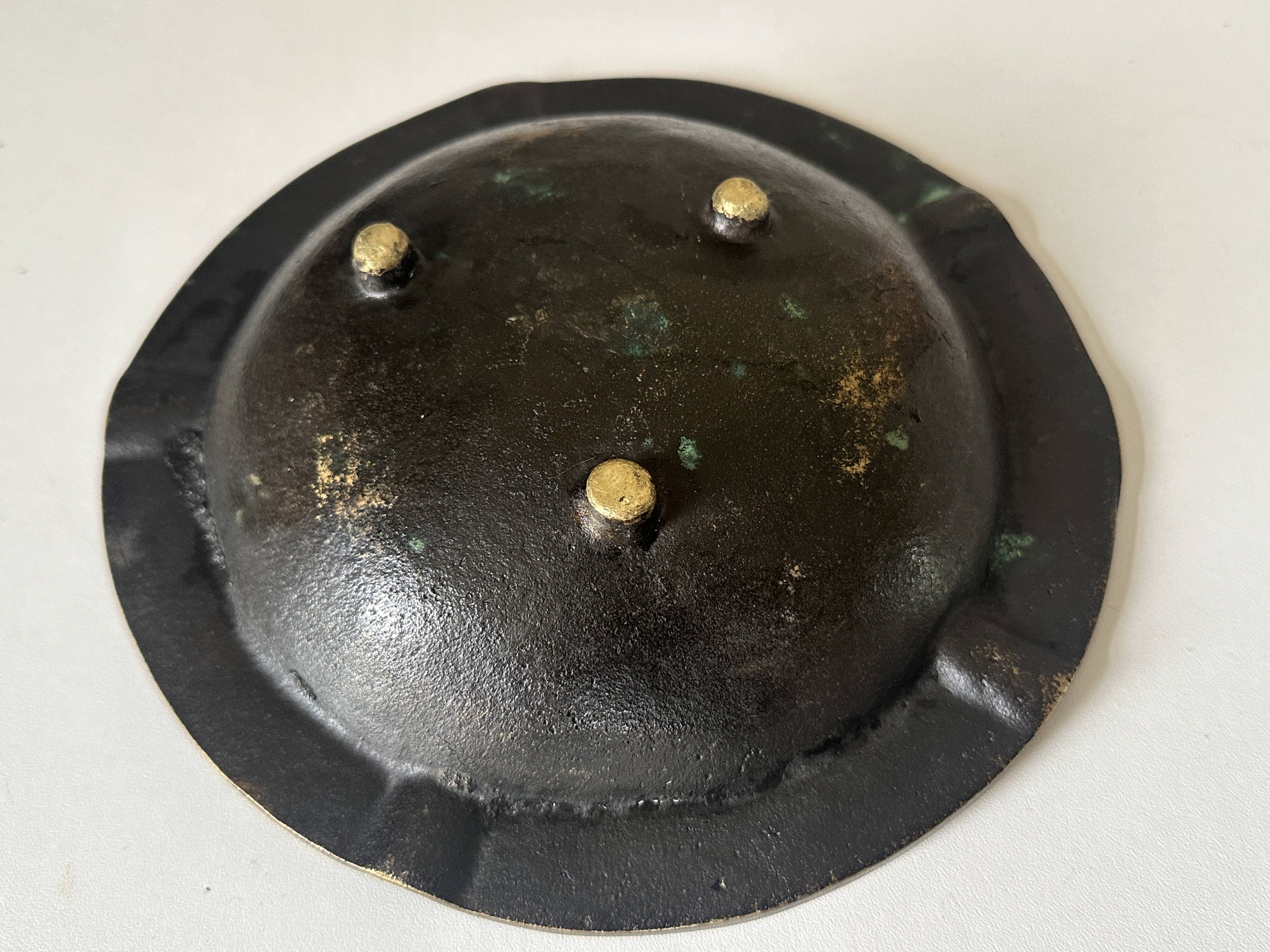 Vintage bronze ashtray design from the 60s