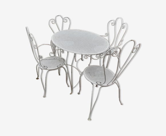 Garden furniture in wrought iron of the 70s. 5 pieces, oval table.