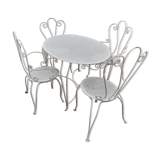 Garden furniture in wrought iron of the 70s. 5 pieces, oval table.
