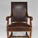 Louis XIII office armchair in leather and walnut carved around 1860