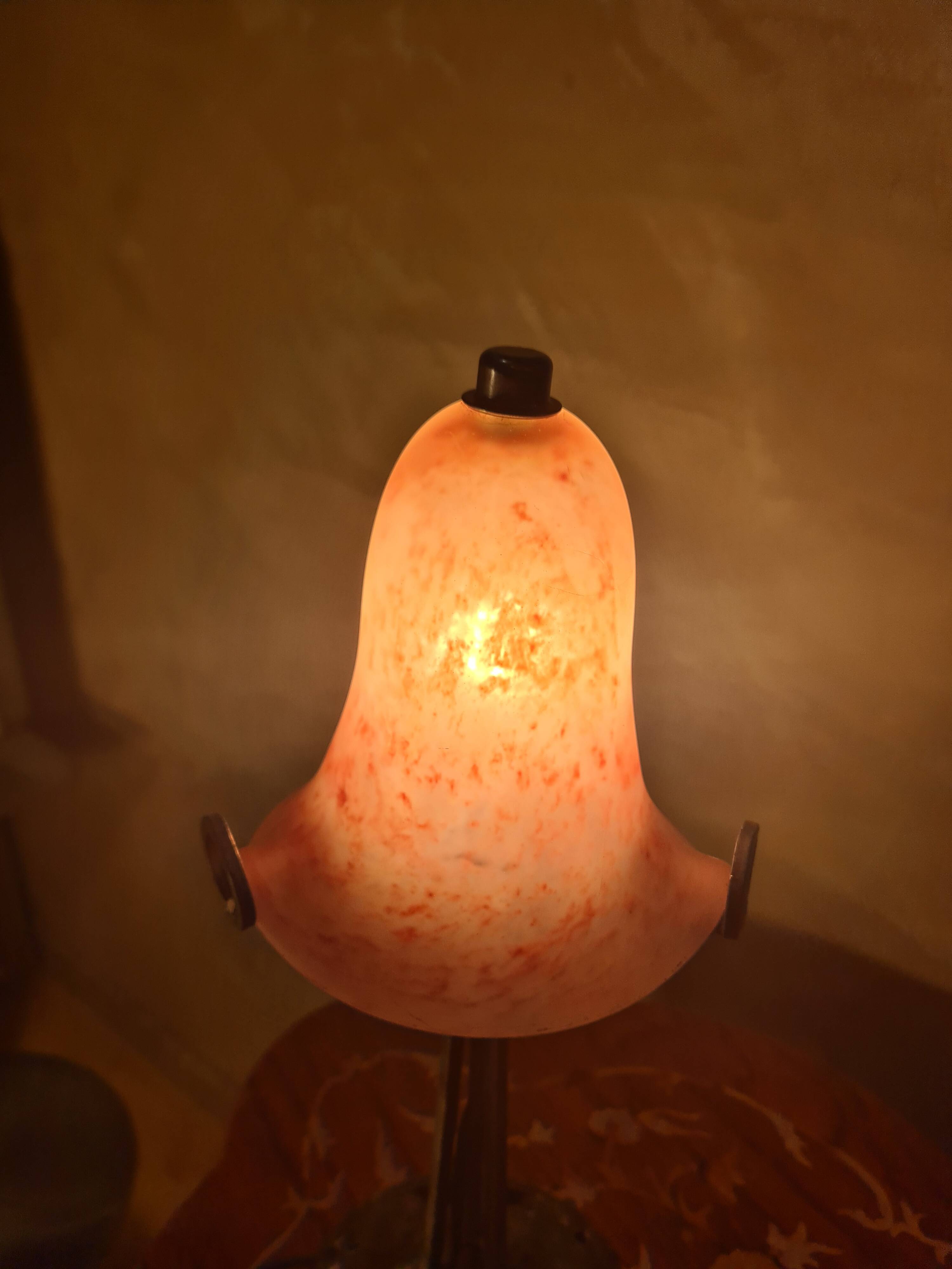 Antique wrought iron floor lamp, 1900, with a glass shade, 40x15.