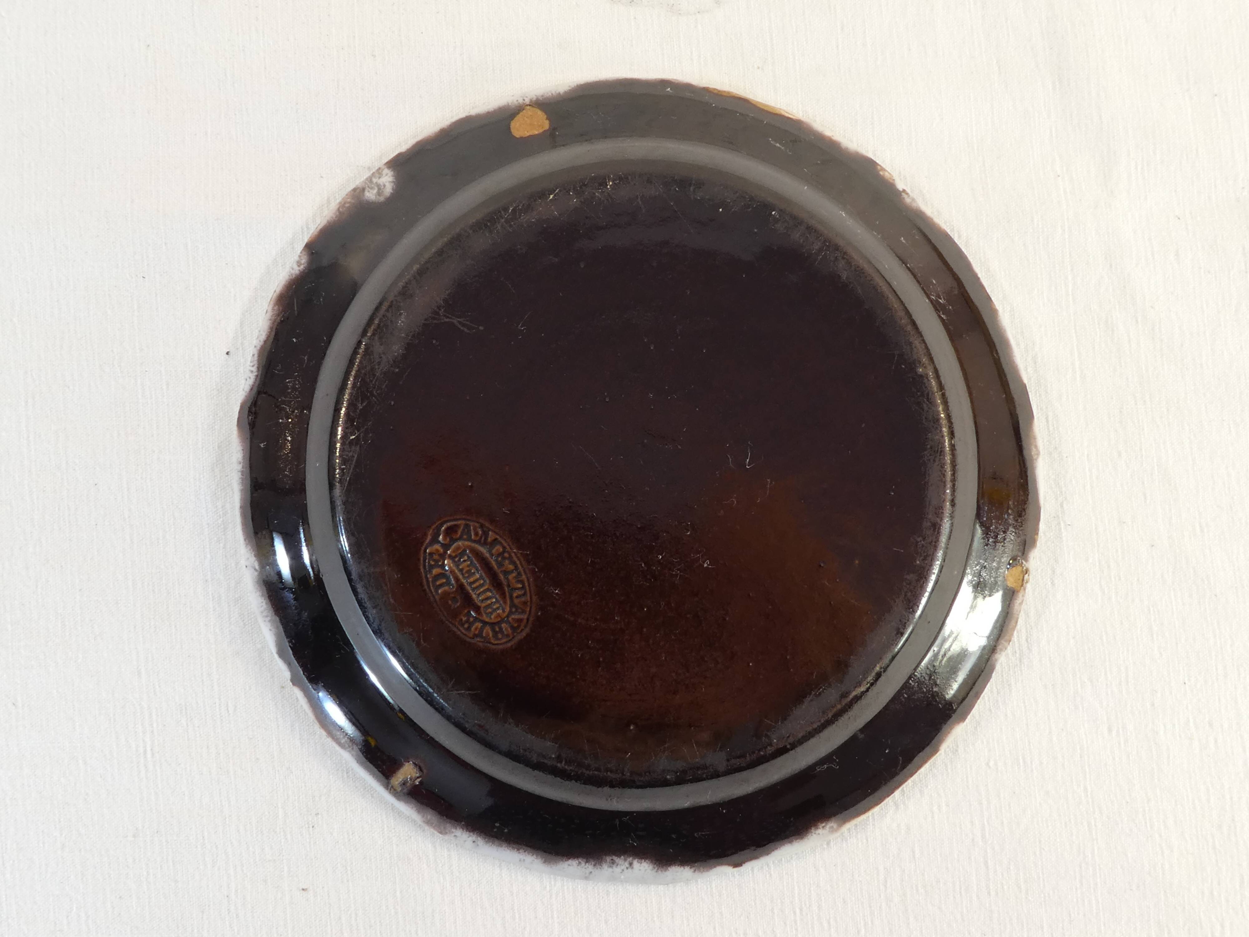 Plate cul noir 19 eme in faience of rouen de la metairie