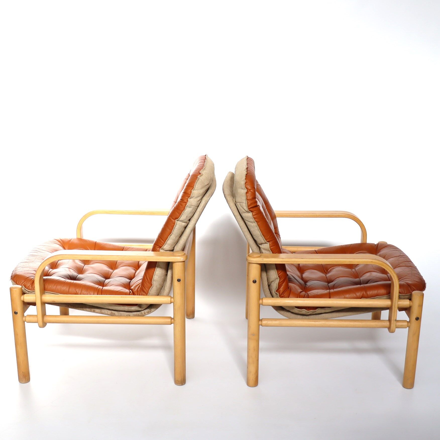 Upholstered leather armchairs 70s