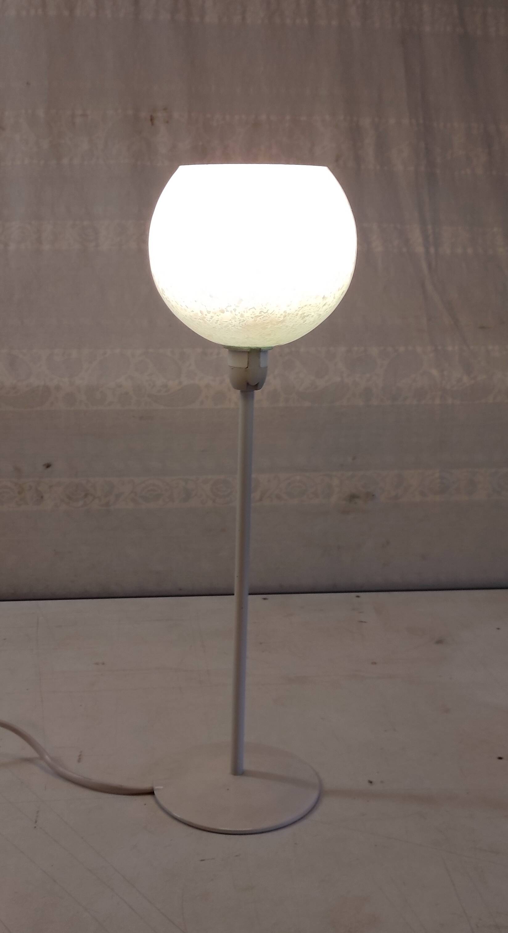 Table lamp with a pale green Clichy glass globe.
