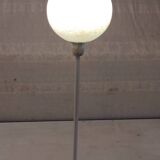 Table lamp with a pale green Clichy glass globe.