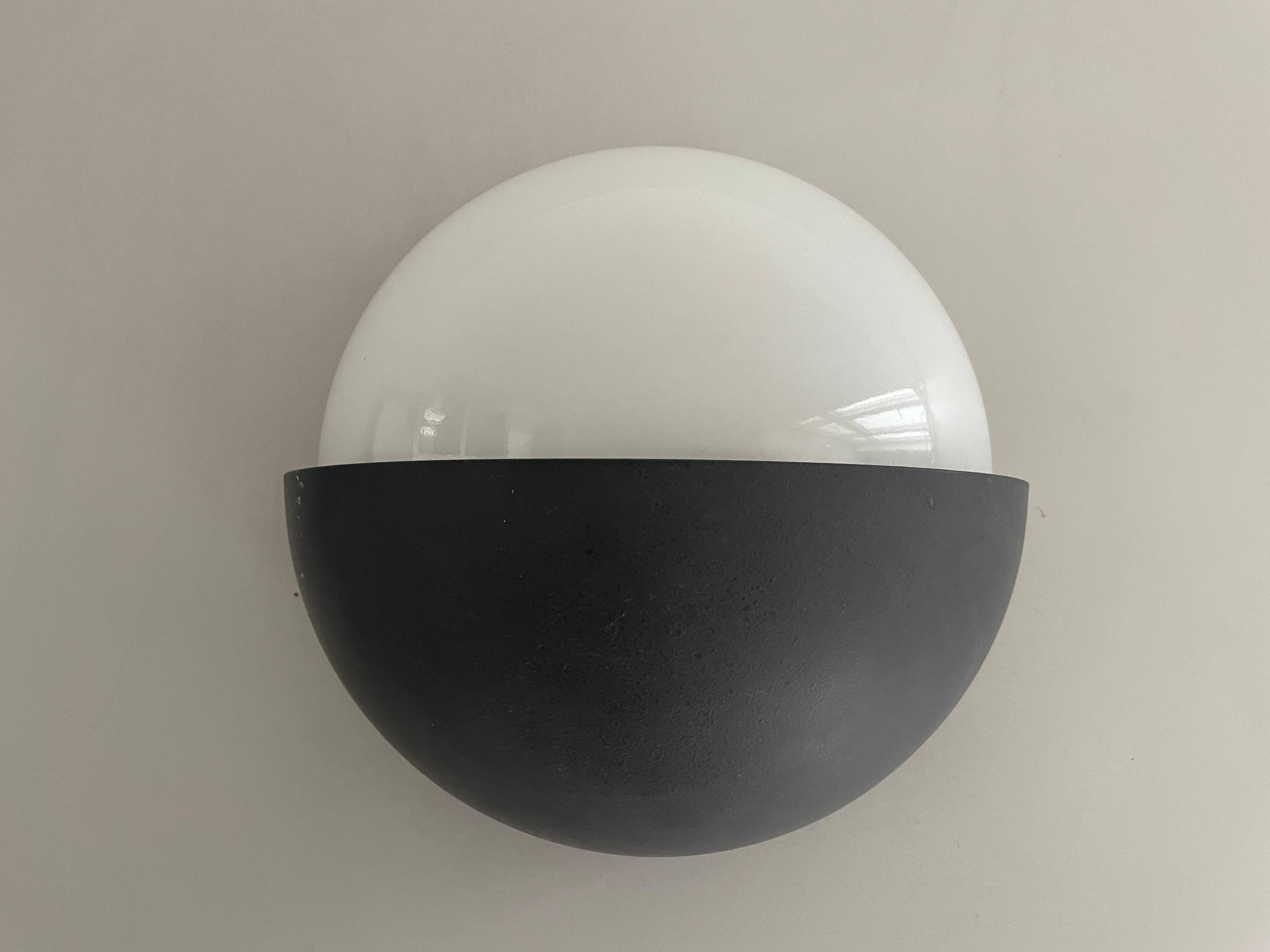 Round black metal wall lights, small and large set, by Bega, 1970s, Germany.