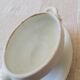Vintage white earthenware mustard pot or sauce boat.