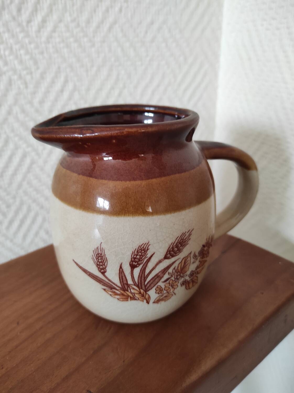 Glazed ceramic pitcher