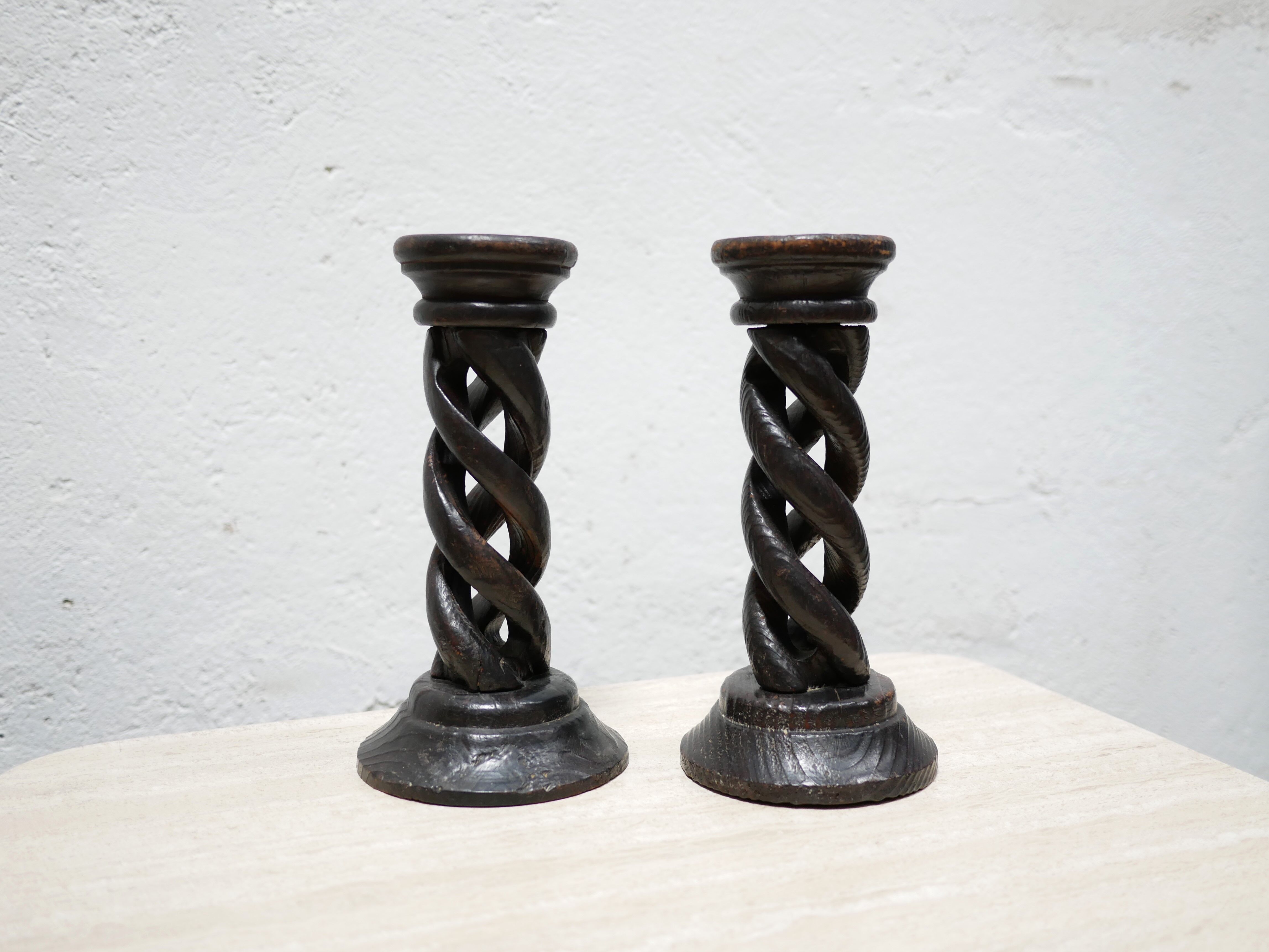 Pair of antique turned wooden candle holders