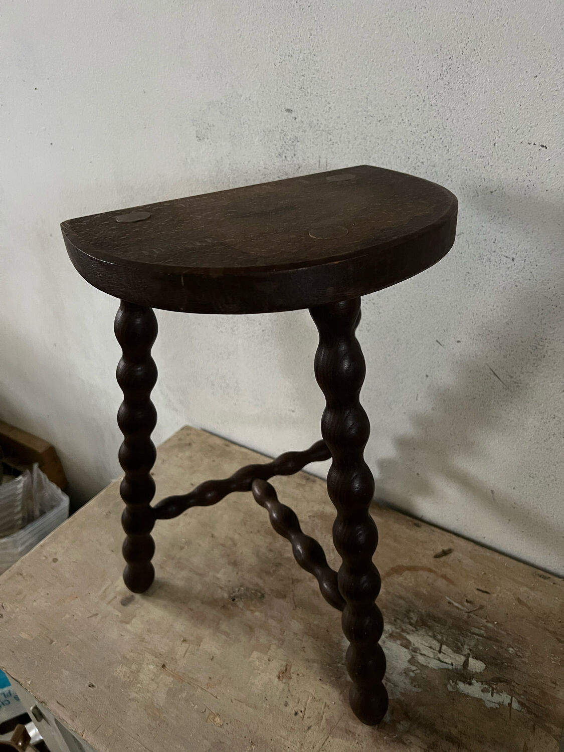 Wooden tripod farm stool