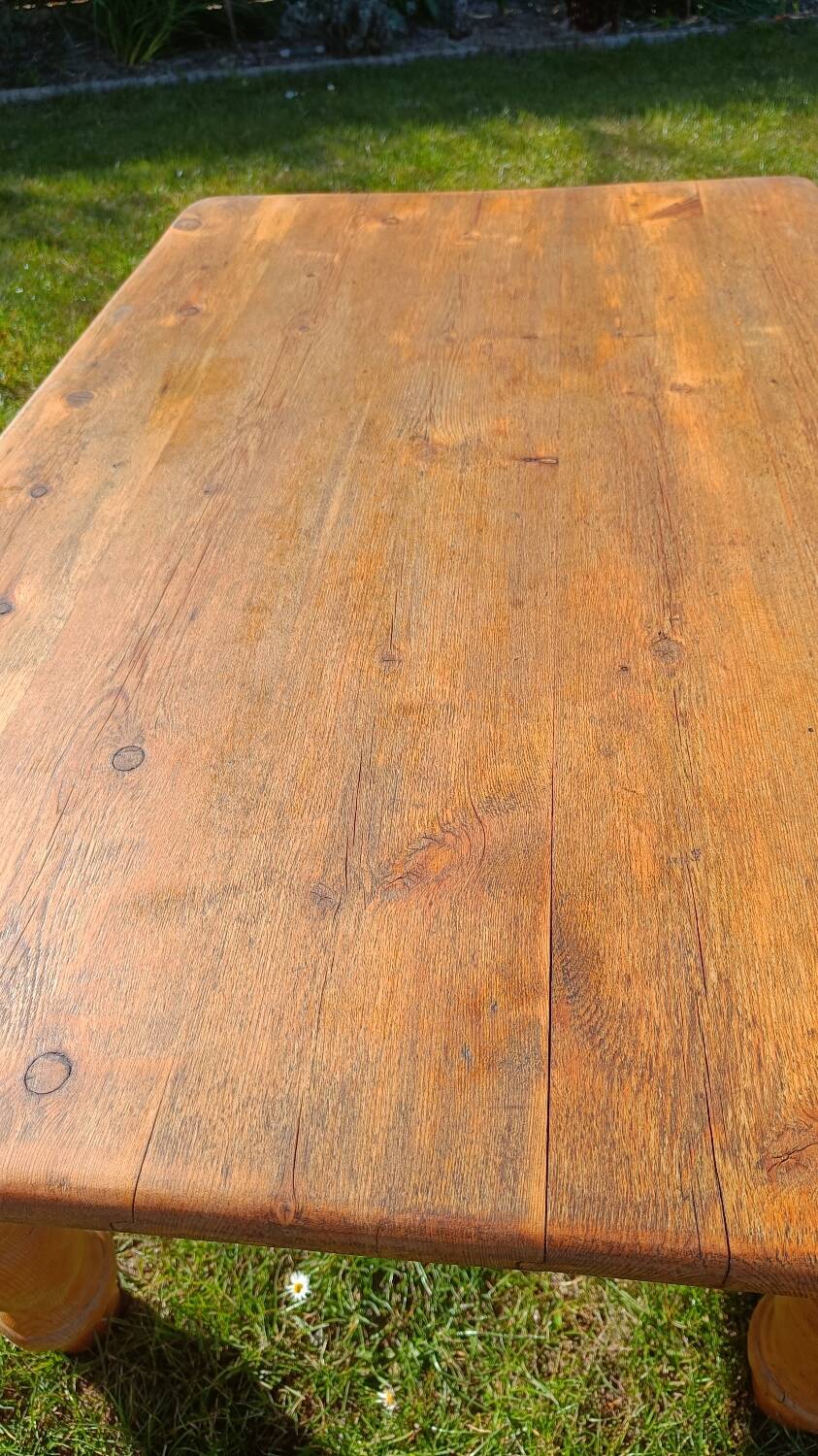 Solid oak coffee table with turned legs.