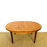 Oval teak dining table with extension