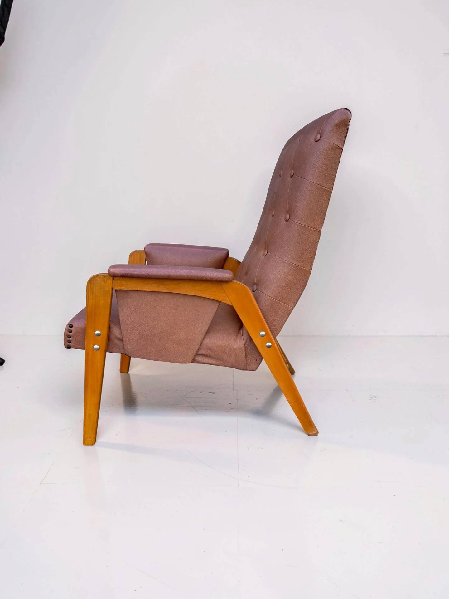 Vintage armchair in light brown faux leather, 1960s.