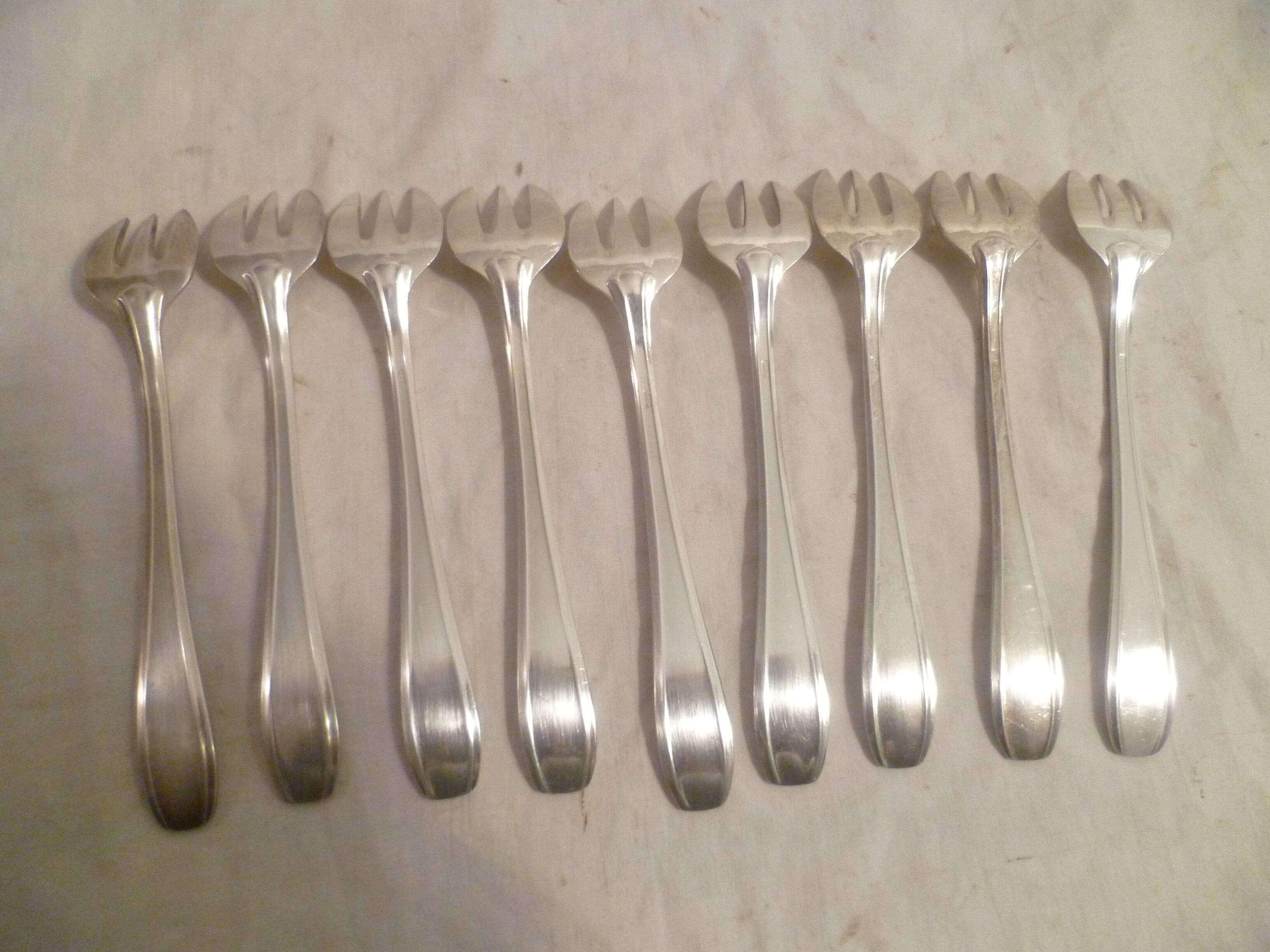 Set of 9 art deco silver oyster forks