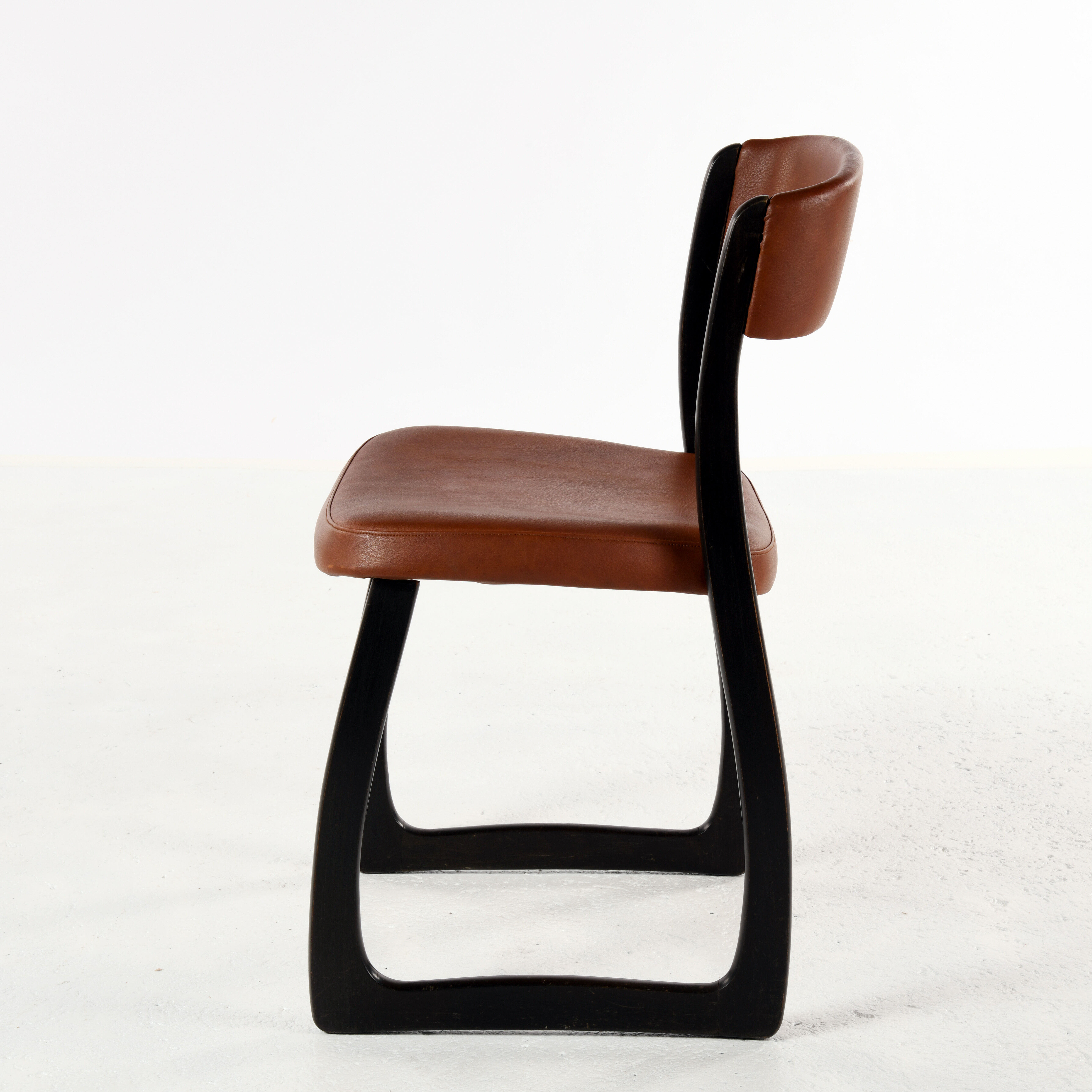 Set of 4 vintage wood and skai sled chairs