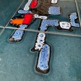 Coffee table in signed ceramic and chromed metal 70s