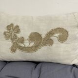 Cushion in vintage fabric with ornamentation