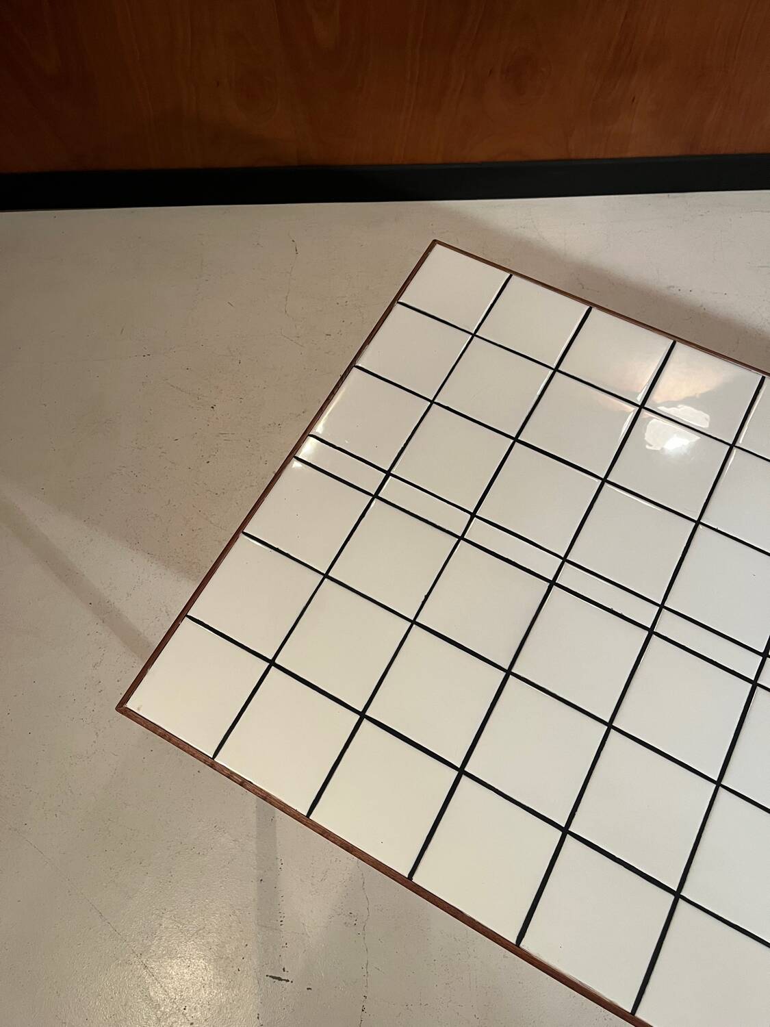 Custom modernist table, steel and earthenware.