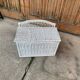 Vintage white wicker chest with double lid and decorative weaving.