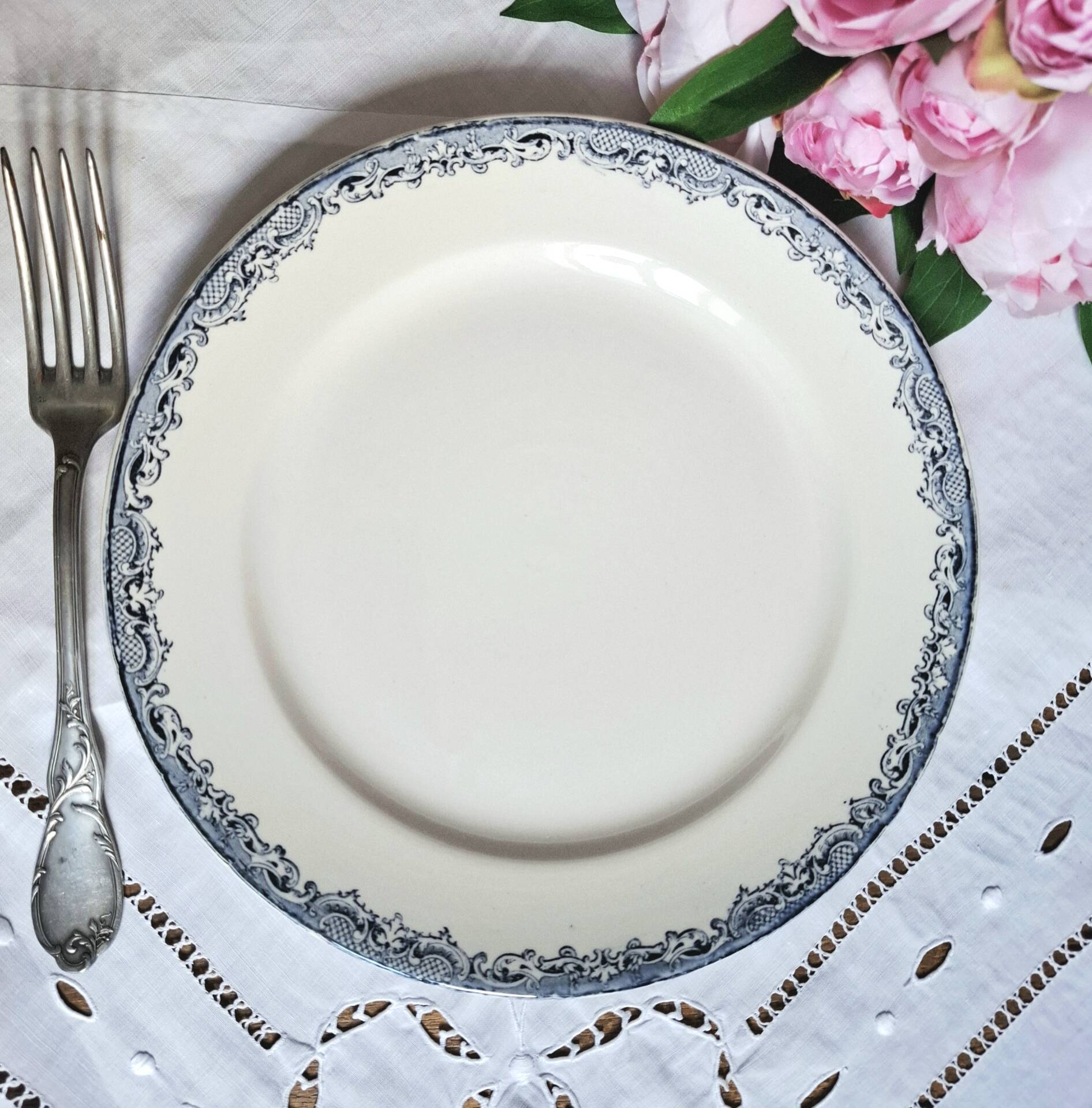 Old mismatched flat plates made of ironstone earthenware.