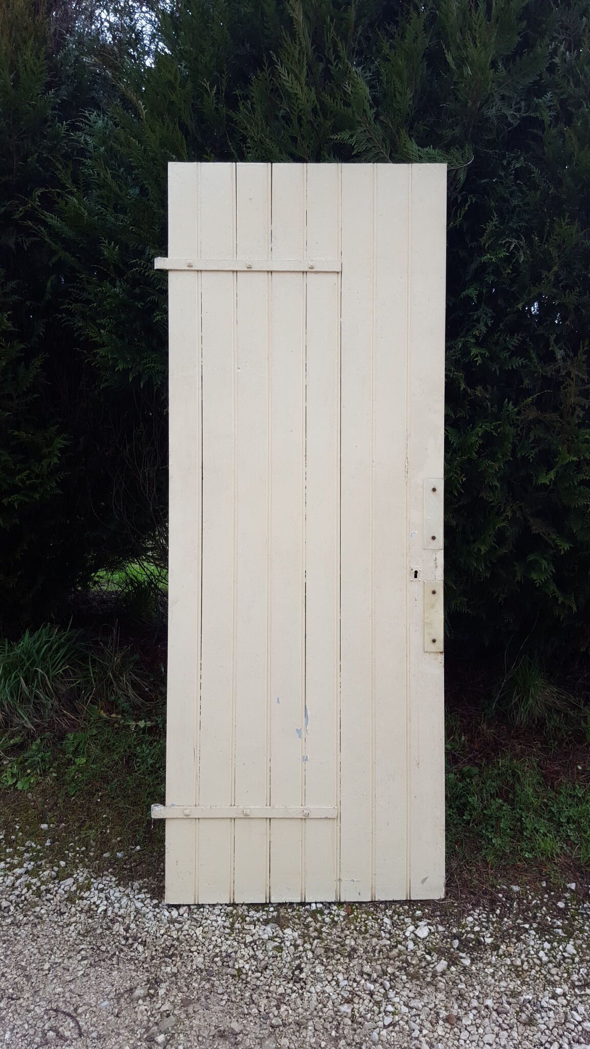 Old door in cream lacquered wood