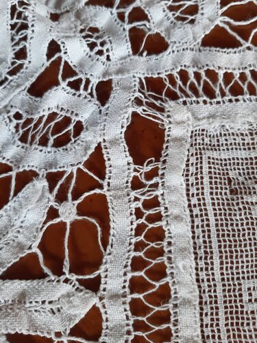 Set of two matching white placemats, embroidered, openwork. One round, one square. 50s.