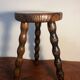 Round wooden tripod stool