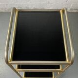 Small rolling trolley in brass and black plastic