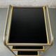 Small rolling trolley in brass and black plastic