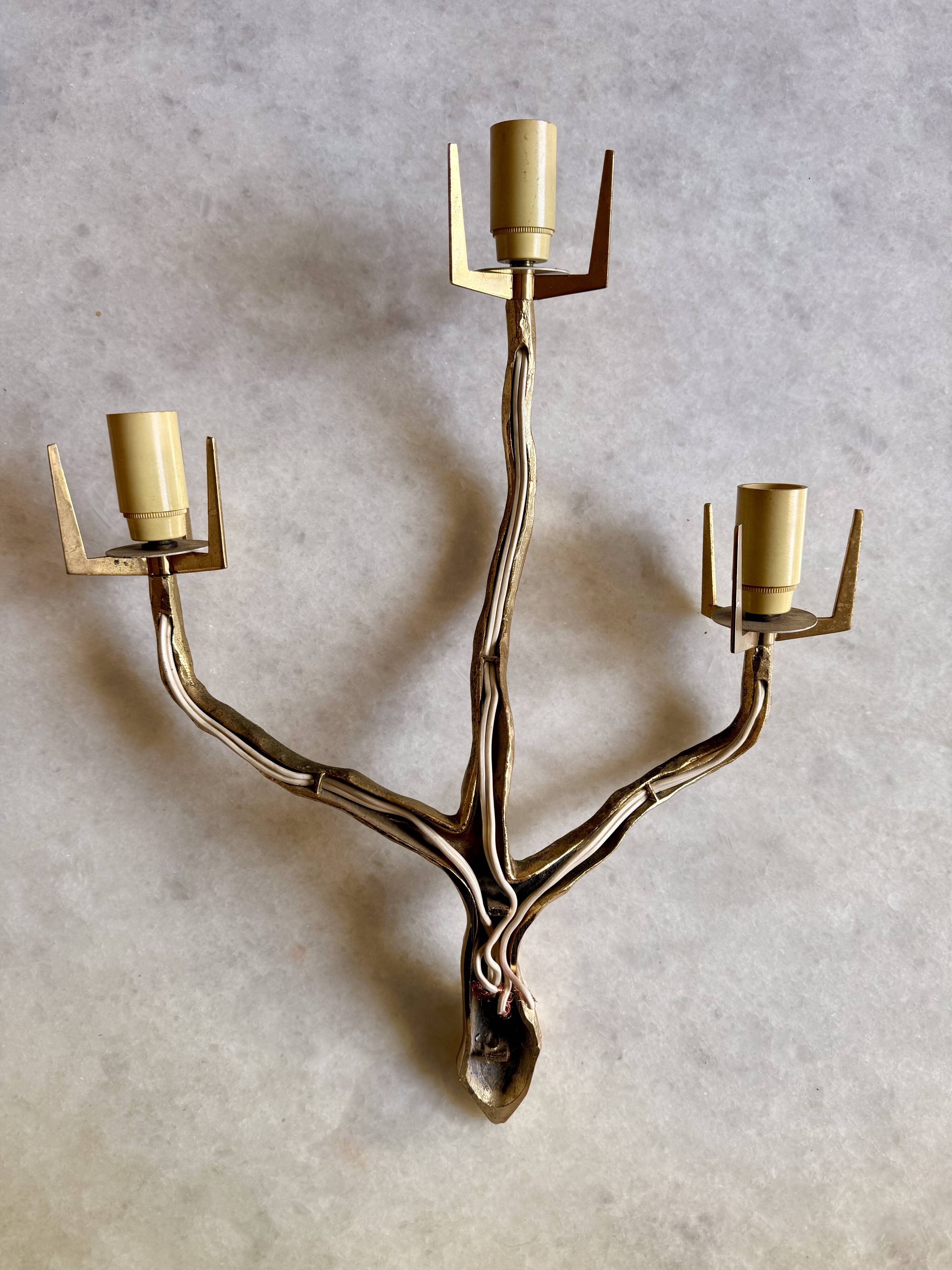 Pair of wall lights by Maison Arlus by Felix Agostini in bronze.