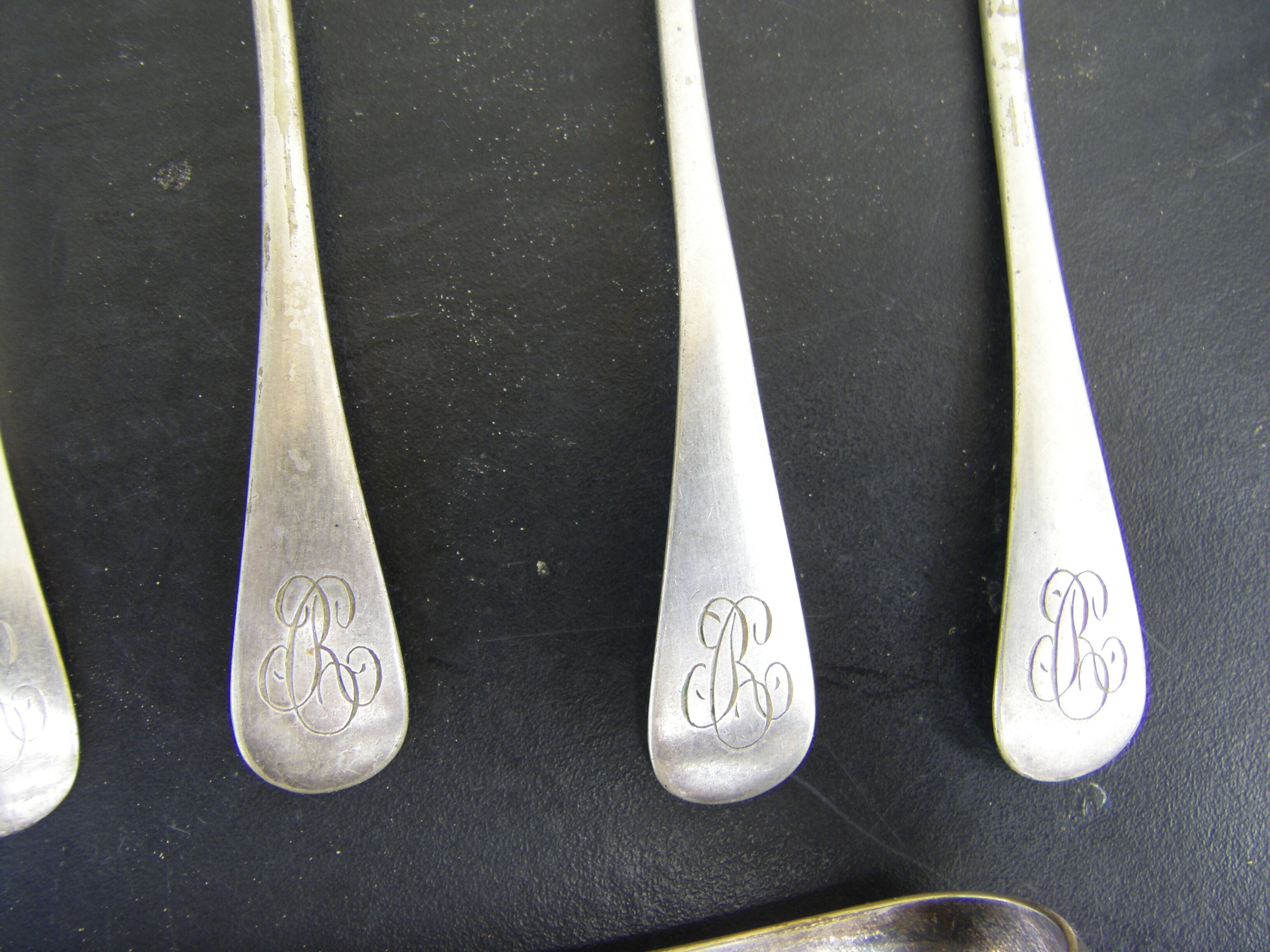 Set of twelve teaspoons and a sugar tongs