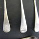 Set of twelve teaspoons and a sugar tongs
