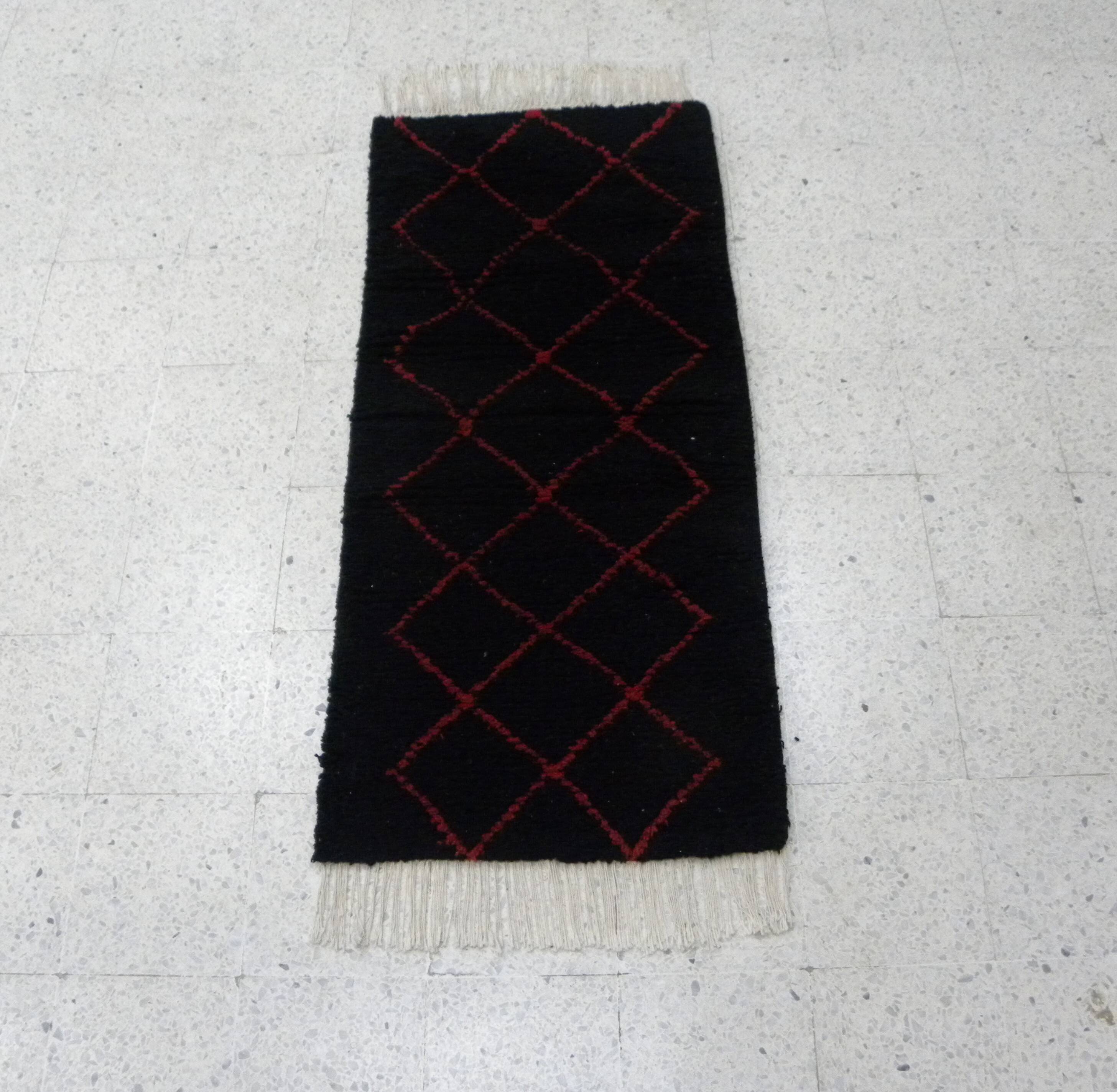Vintage ancestral black Berber rug in wool