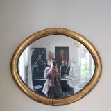 Oval mirror with gold leaf