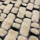 Large cream and black checked Berber rug, 280 × 200 cm.