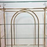 Hollywood Regency brass and glass shelf with elephant heads from the 1970s