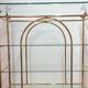 Hollywood Regency brass and glass shelf with elephant heads from the 1970s