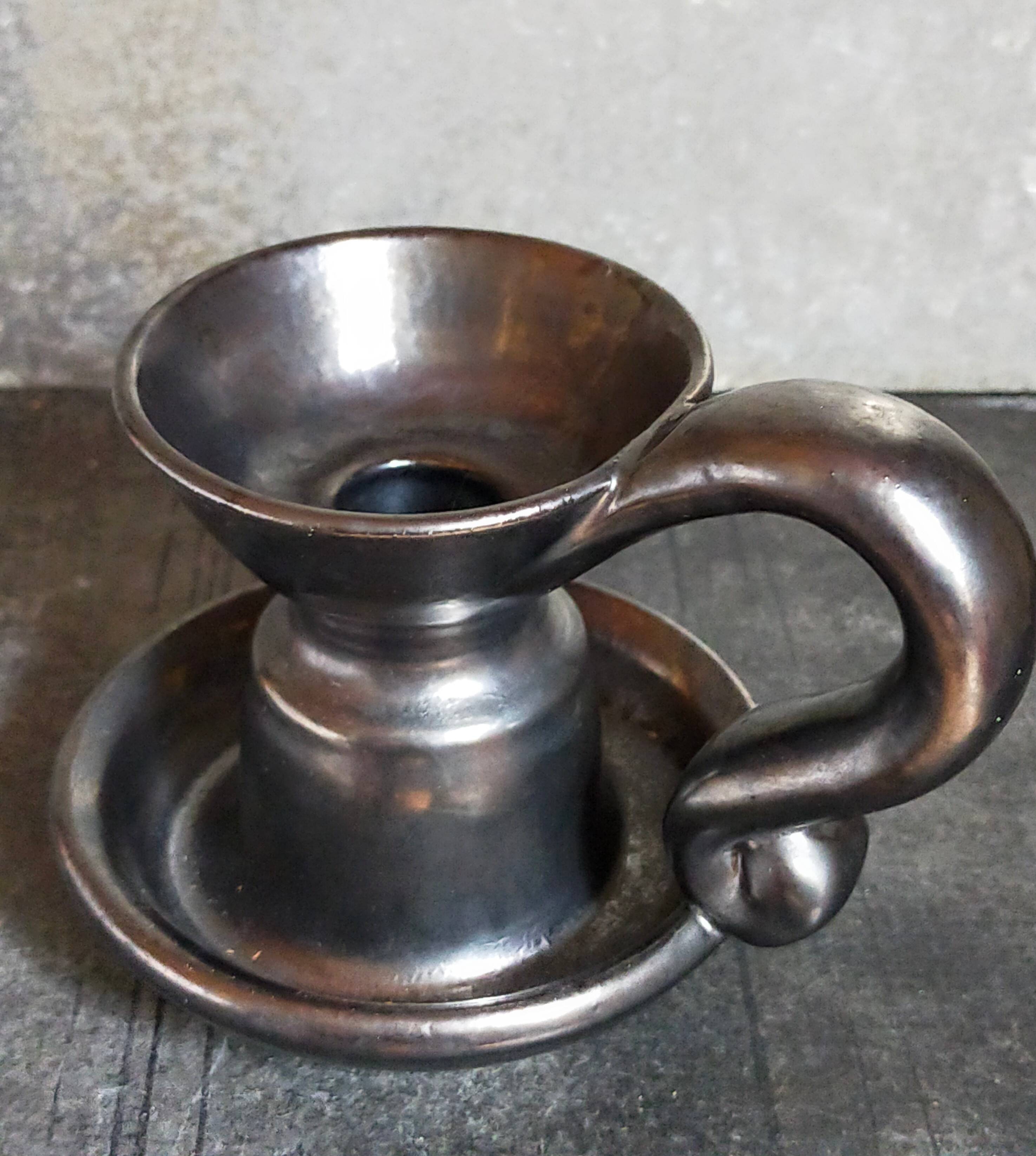 1950s iridescent black ceramic hand candle holder