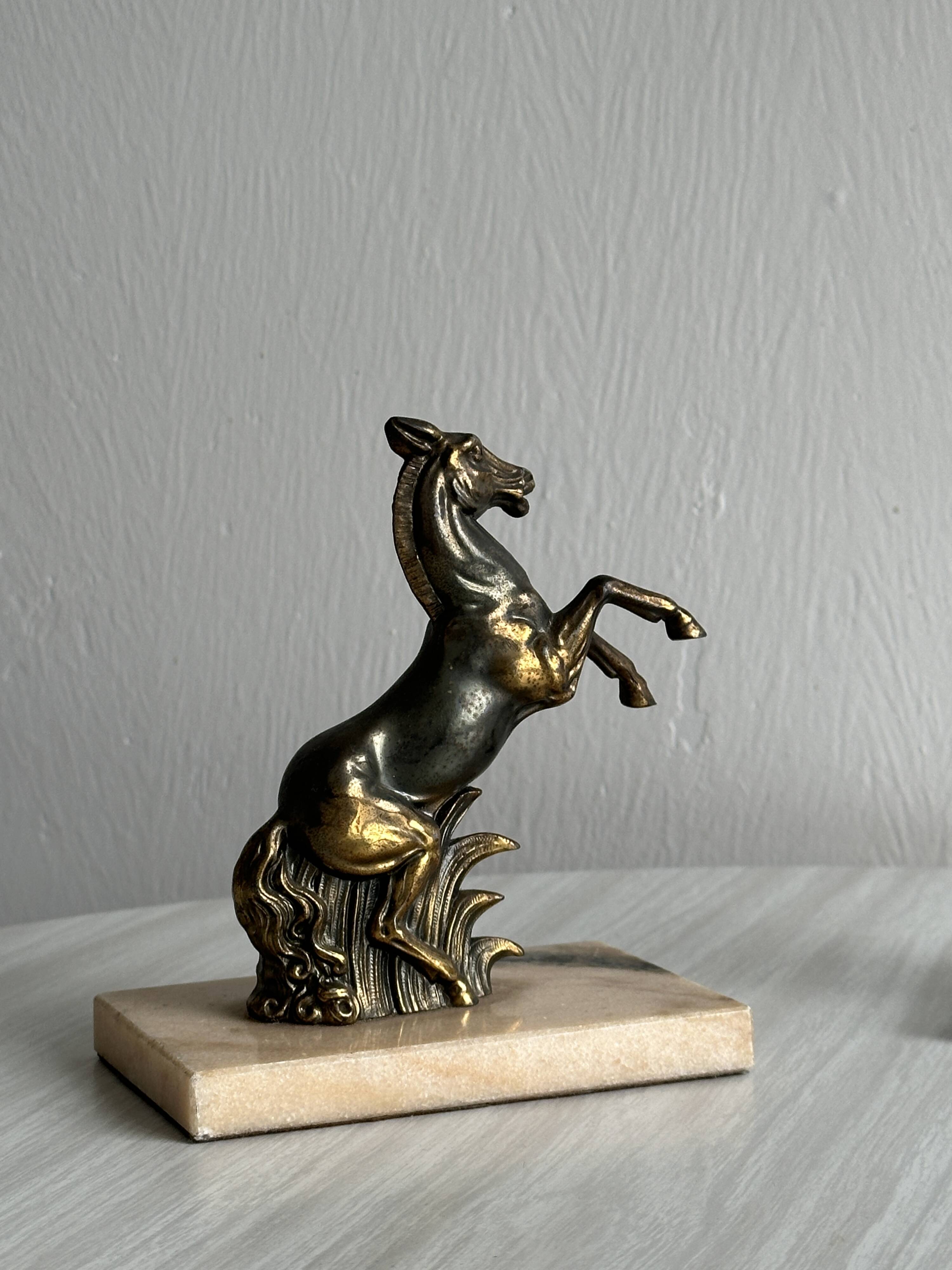 Paire de serre-livres en métal doré